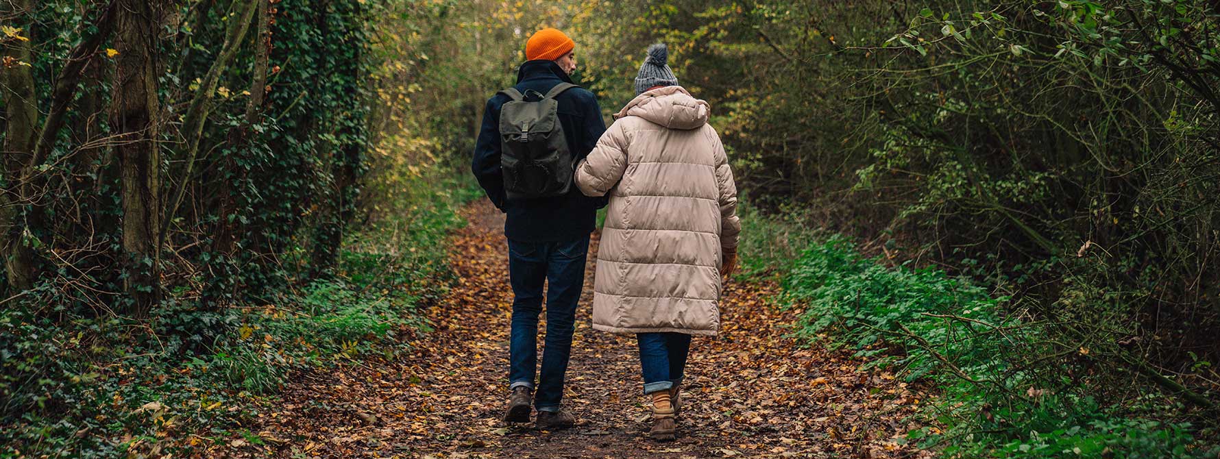 couple going for an autumn walk in the woods